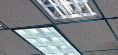 Two light troffers in a teal ceiling grid — reference photo from another AESS job, Sonos installation Upper West Side, Manhattan Upper West Side, Manhattan Sonos installation reference photo: two lay-in light troffers set into a drop ceiling with a teal-painted grid