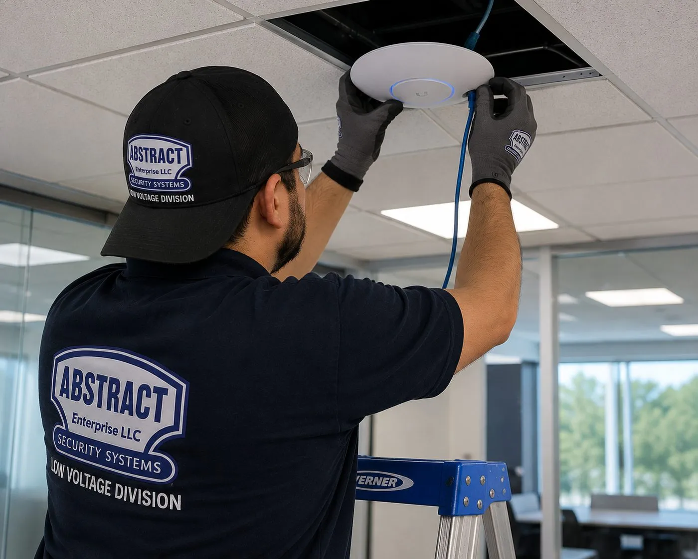 Ceiling Wi-Fi access point install — Brooklyn network for streaming soundbars Technician fitting a ceiling-mounted wireless access point with its network cable into a drop ceiling in a Brooklyn office