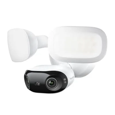 Reolink-style wireless floodlight camera deployed across NYC — motion deterrent for stoops, driveways, side alleys